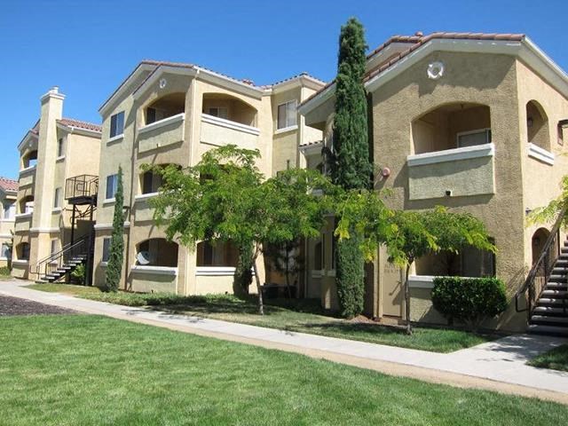 View of apt buildings and grass Apt rentals in Elk Grove l Siena Villas