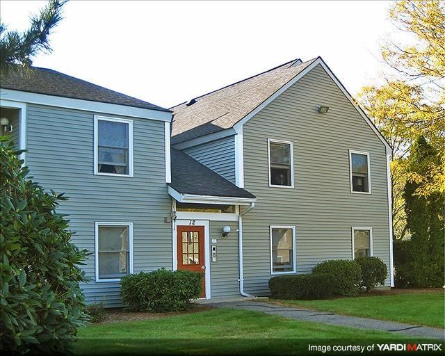 a blue house with a red door