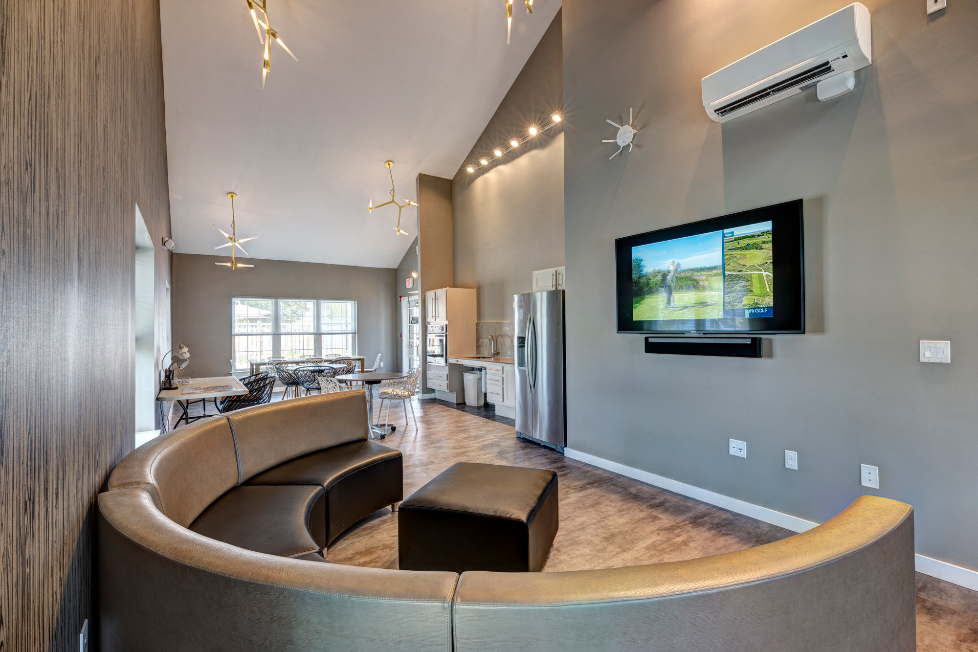 a living room with a couch and a tv