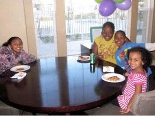 a group of people sitting around a table