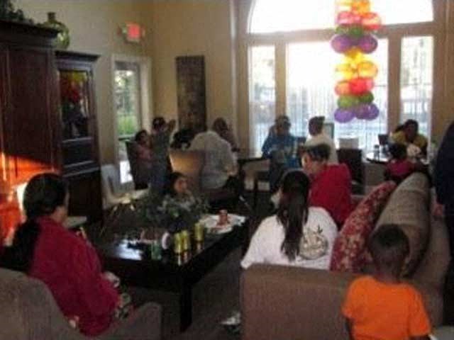a group of people sitting in a living room