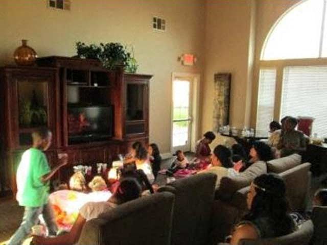 a group of people sitting in a living room