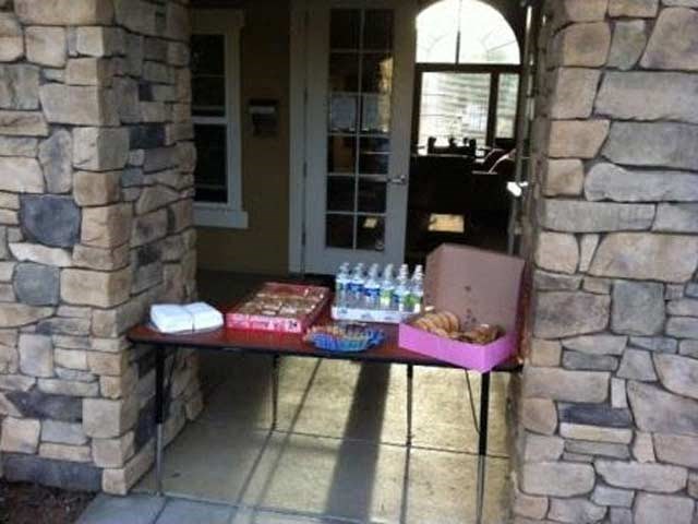 a table with boxes of food and bottles of water
