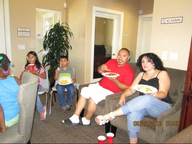 a group of people sitting in a living room