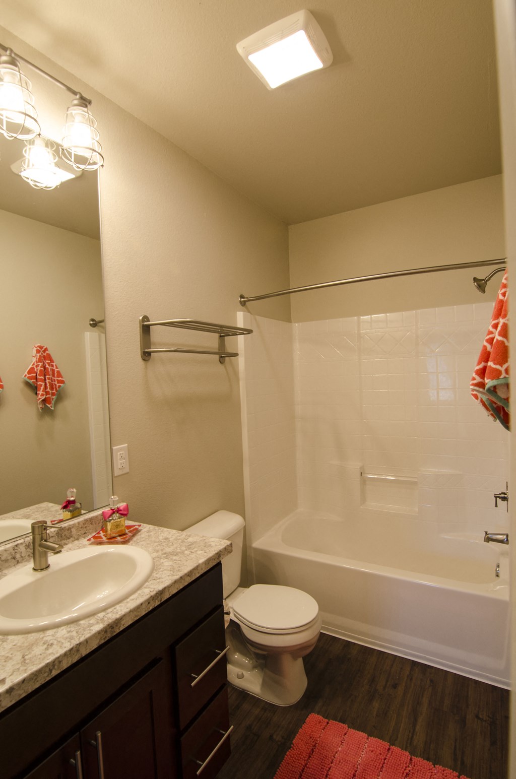a bathroom with a shower toilet and sink