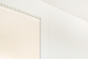 an empty living room with white walls and wood floors