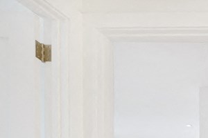 a white laundry room with a washer and dryer in it
