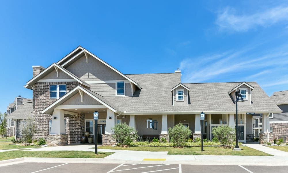 a large house with a parking lot in front of it