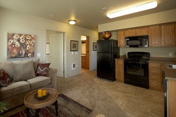 Living room and kitchen l Tressa Apartments in Seattle WA - Photo Gallery 5
