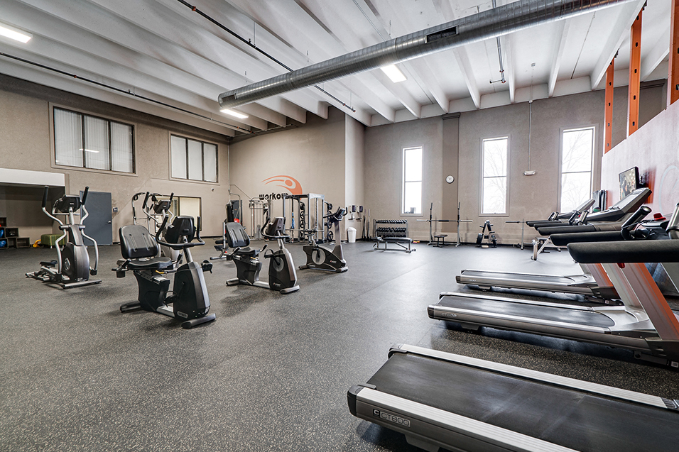 wide shot of treadmills and other fitness equipment
