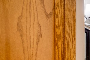 Bathroom with wooden cabnets and striped shower curtain - Photo Gallery 4