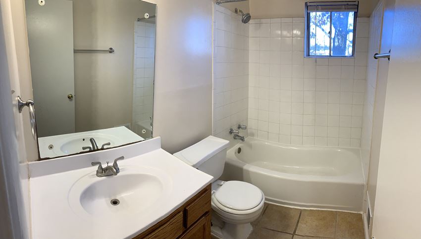 a bathroom with a sink toilet and a tub