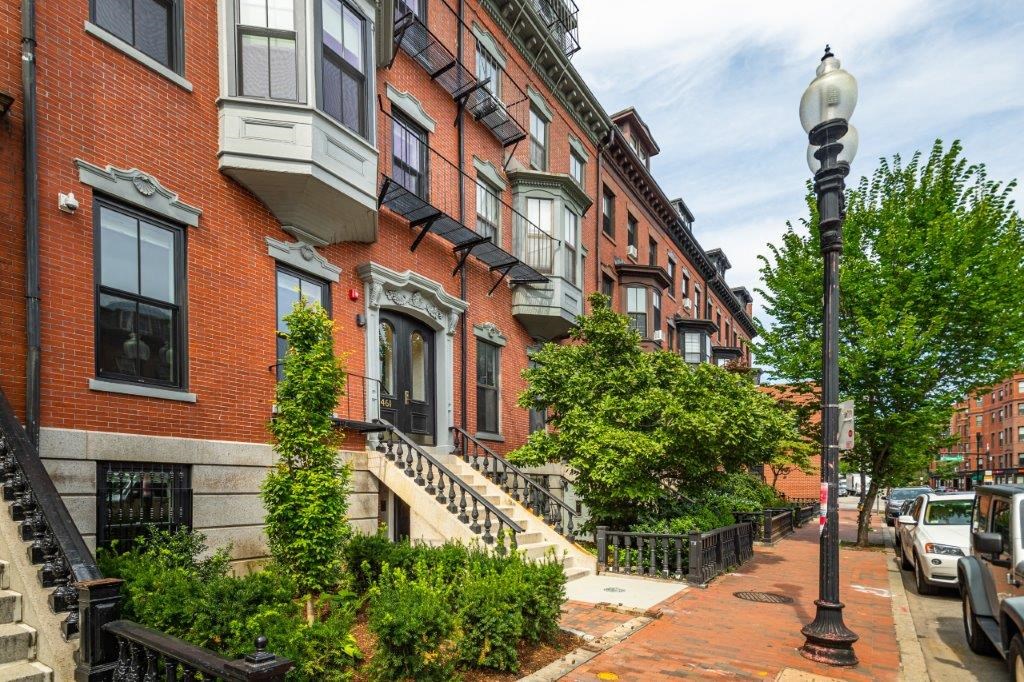 a row of brick buildings on a city street