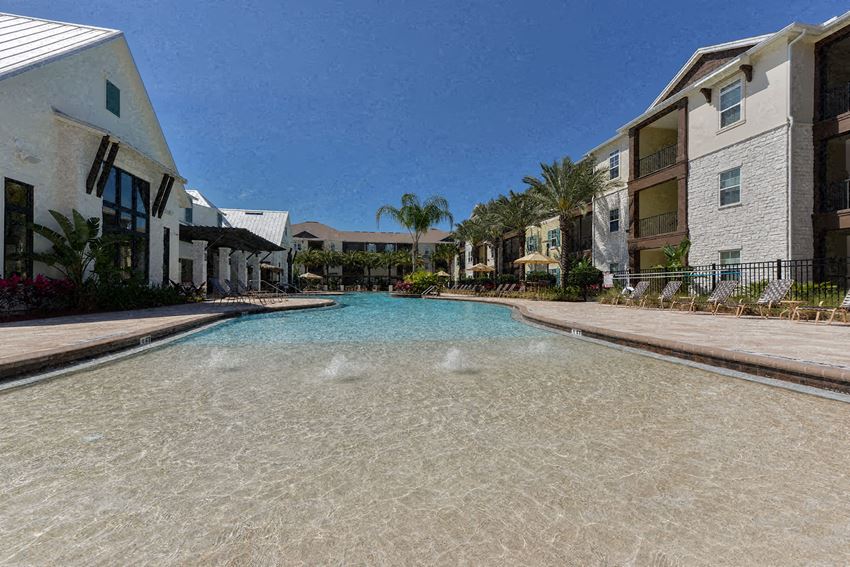 a large swimming pool surrounded by apartment buildings