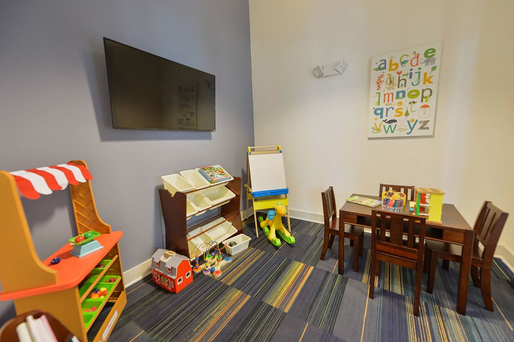 A room with a children's play area and a whiteboard at Cabana Club Apartments, Jacksonville, Florida