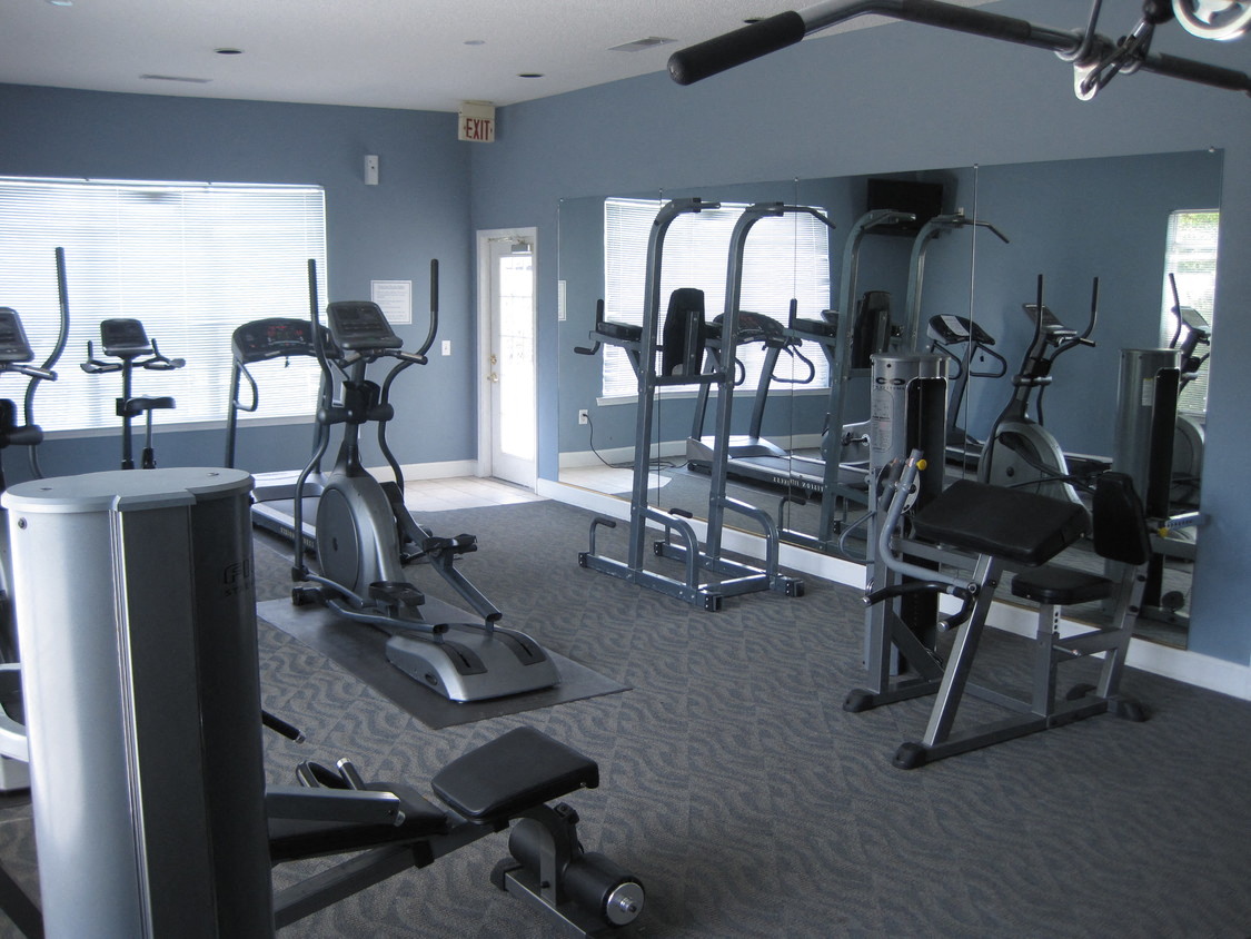 a gym with exercise equipment in a building
