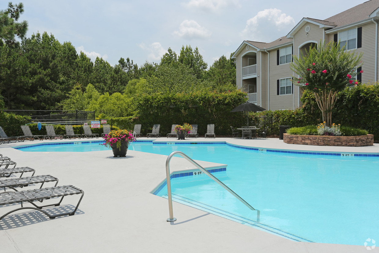 our apartments have a large swimming pool with lounge chairs