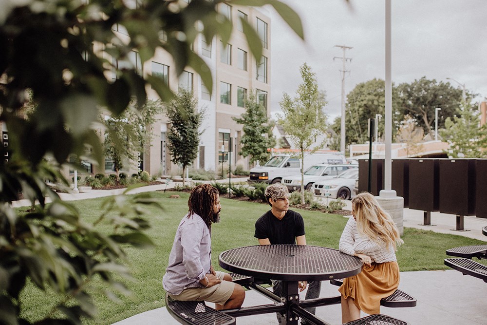 a group of people sitting around a table