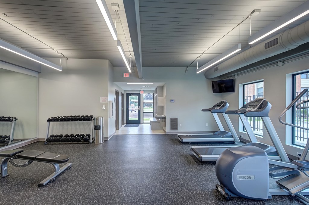 a gym with treadmills and other equipment at the flats at obsidian