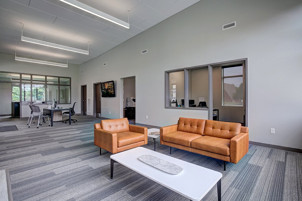 an open office space with couches and a coffee table