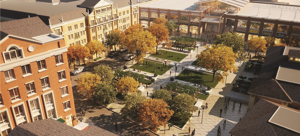 an aerial view of a city park with buildings and trees