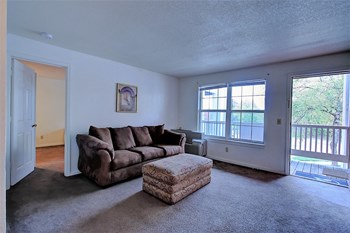 Image of carpeted room with furniture and window - Photo Gallery 3