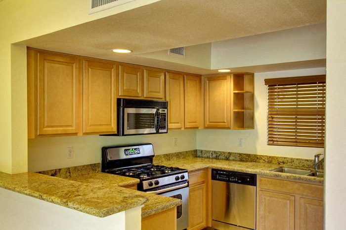 a kitchen with a stove and a microwave