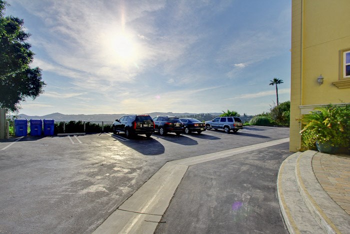 a row of cars parked in a parking lot