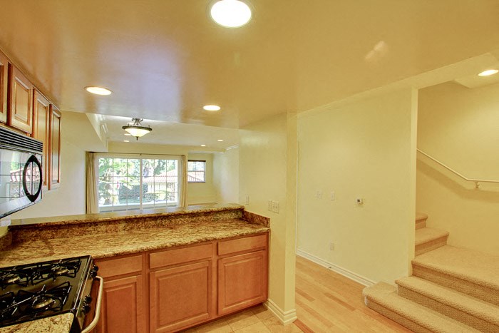 a kitchen with a counter top and a stove