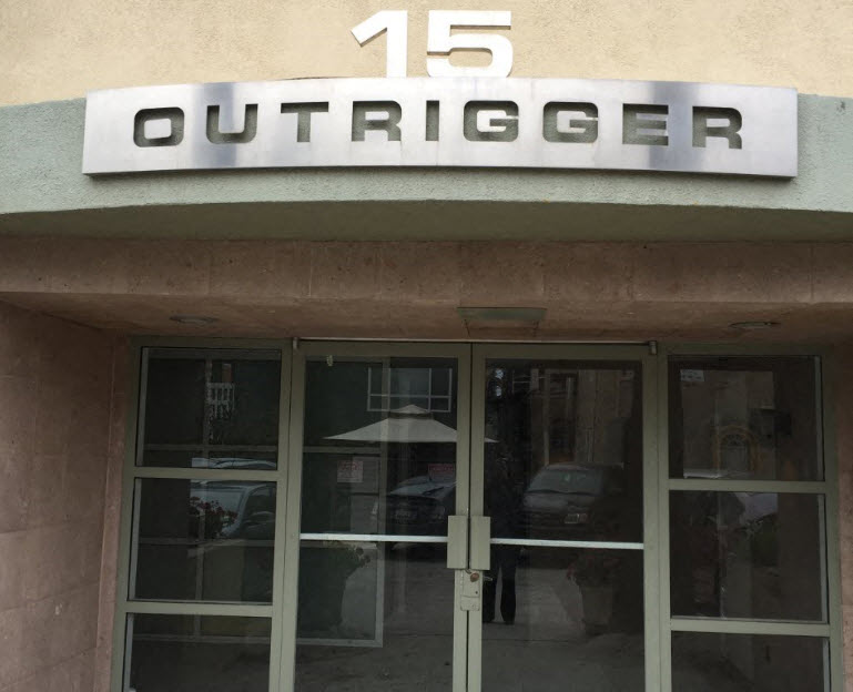 the front of a store with a sign on top of the door