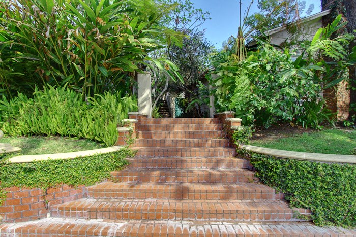 a set of brick stairs leading up to a house