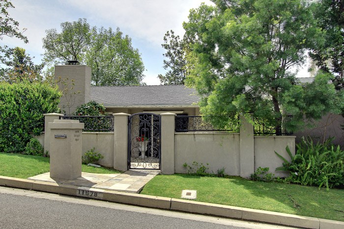 a house with a fence and a gate