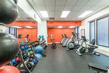 Fitness Center with weights and cardio equipment at Reside on Surf Apartments, Chicago, IL