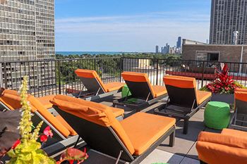 Rooftop deck with lounge chairs at Reside on Surf Apartments, Chicago, IL
