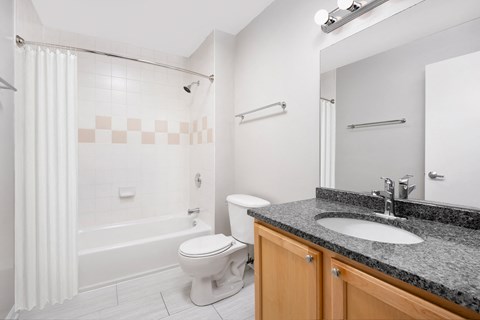 a bathroom with a sink toilet and a shower