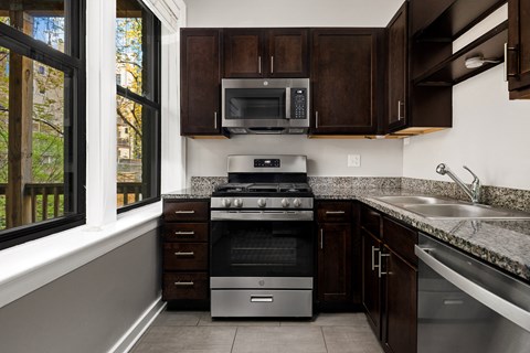 a kitchen with a stove and a window