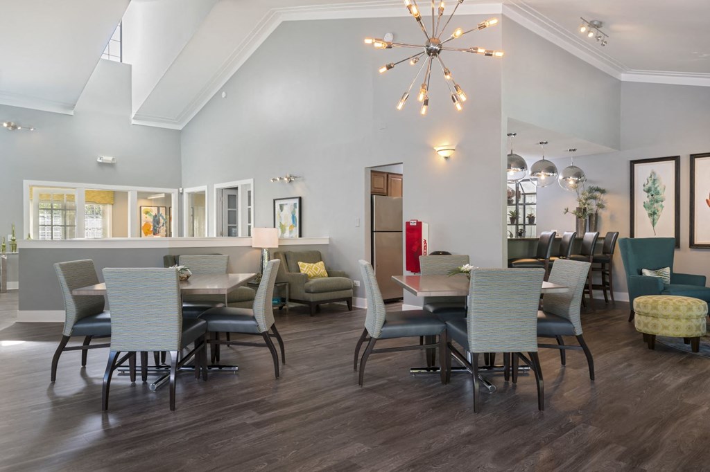 a dining room with a table and chairs and a chandelier