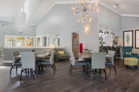 a dining room with a table and chairs and a chandelier