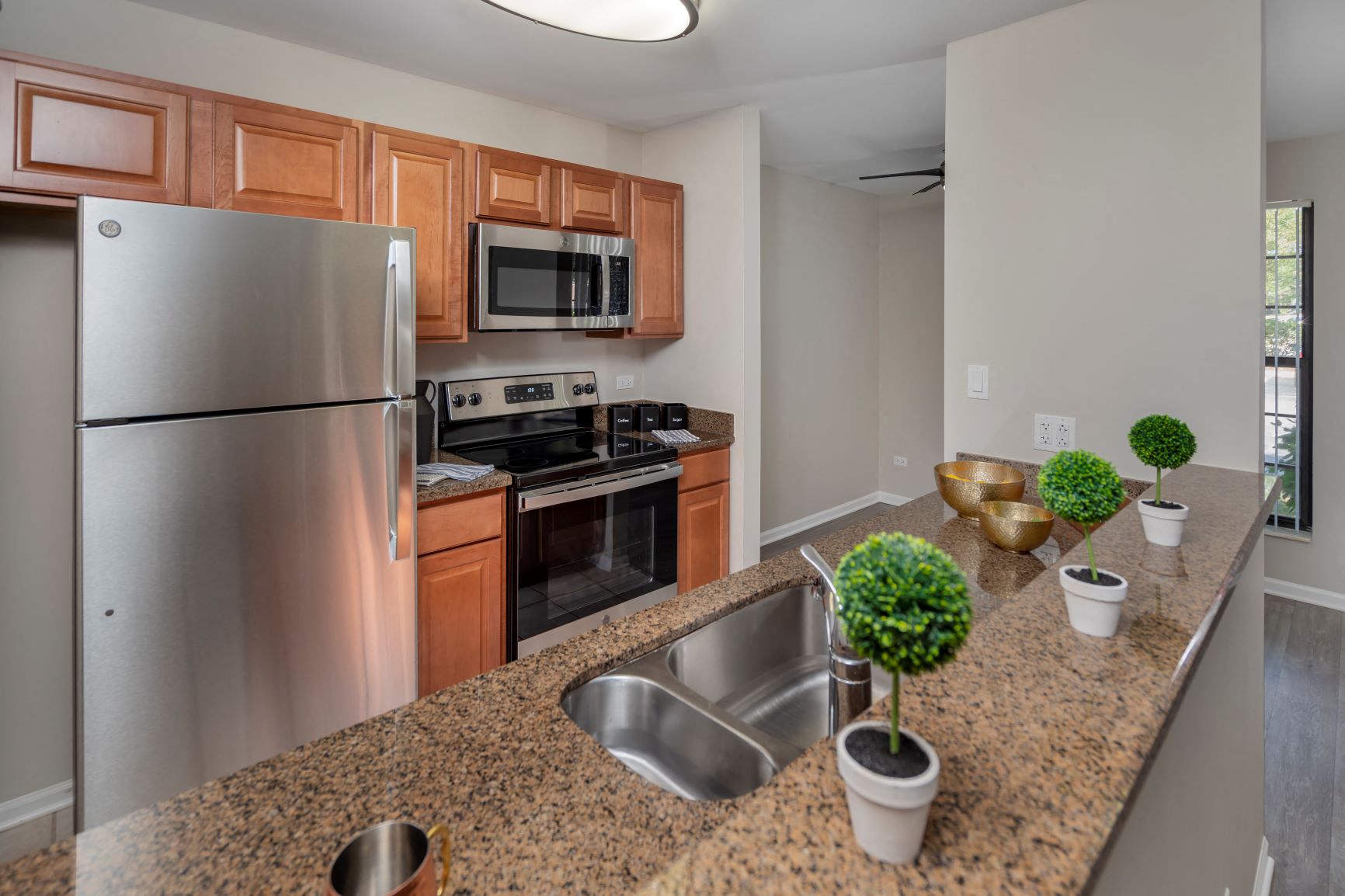 a kitchen with stainless steel appliances and granite counter tops