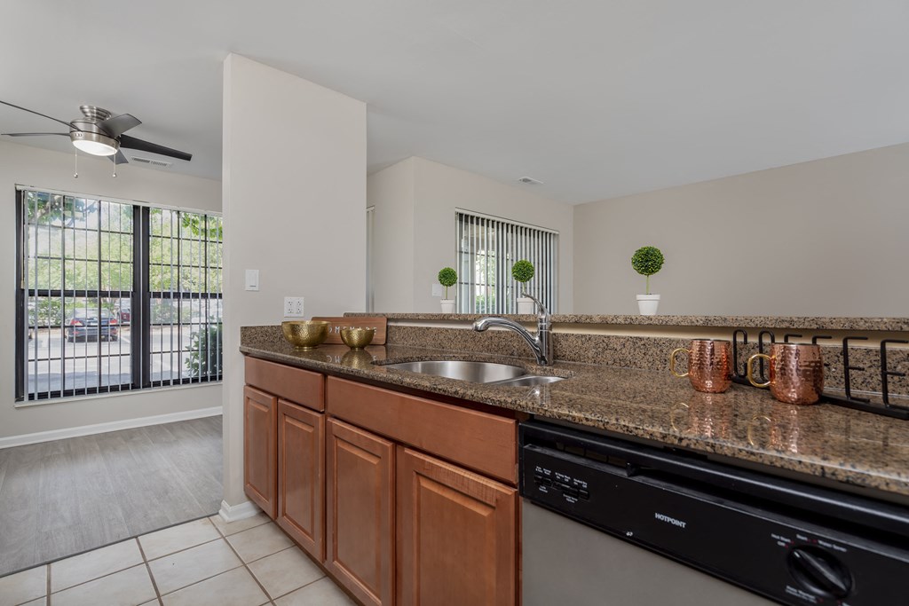 a kitchen with a granite counter top and a sink