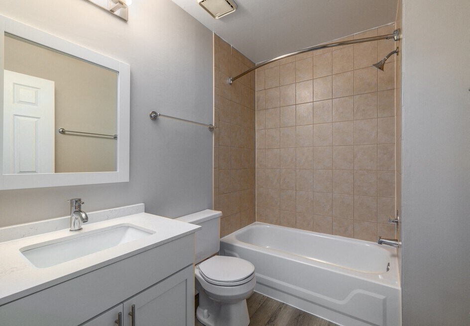 a bathroom with a sink toilet and a tub