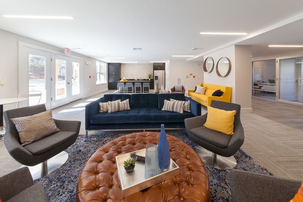 Spacious renovated clubhouse lounge with modern furniture and warm lighting