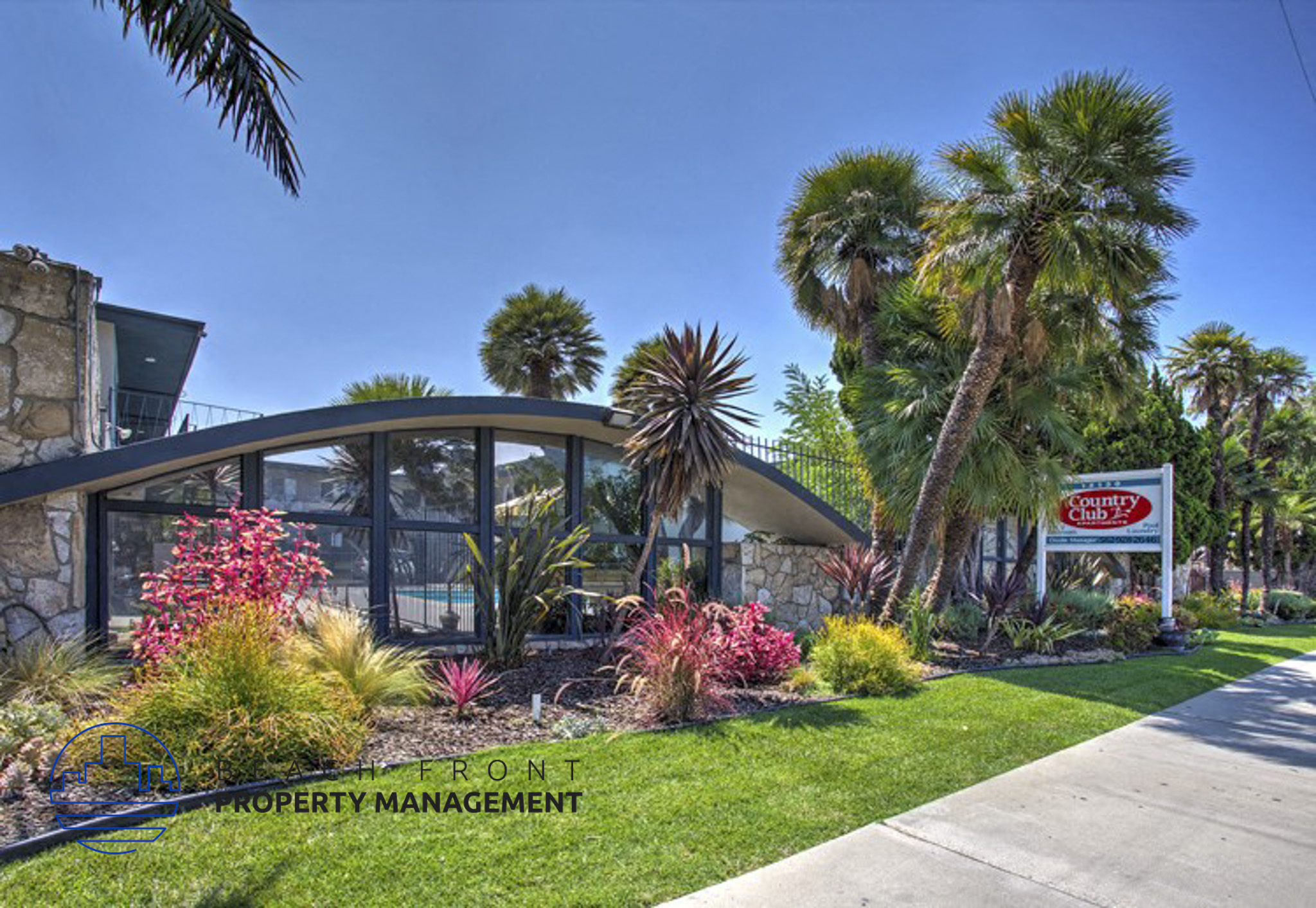 a building with palm trees and a sign for a fast food restaurant