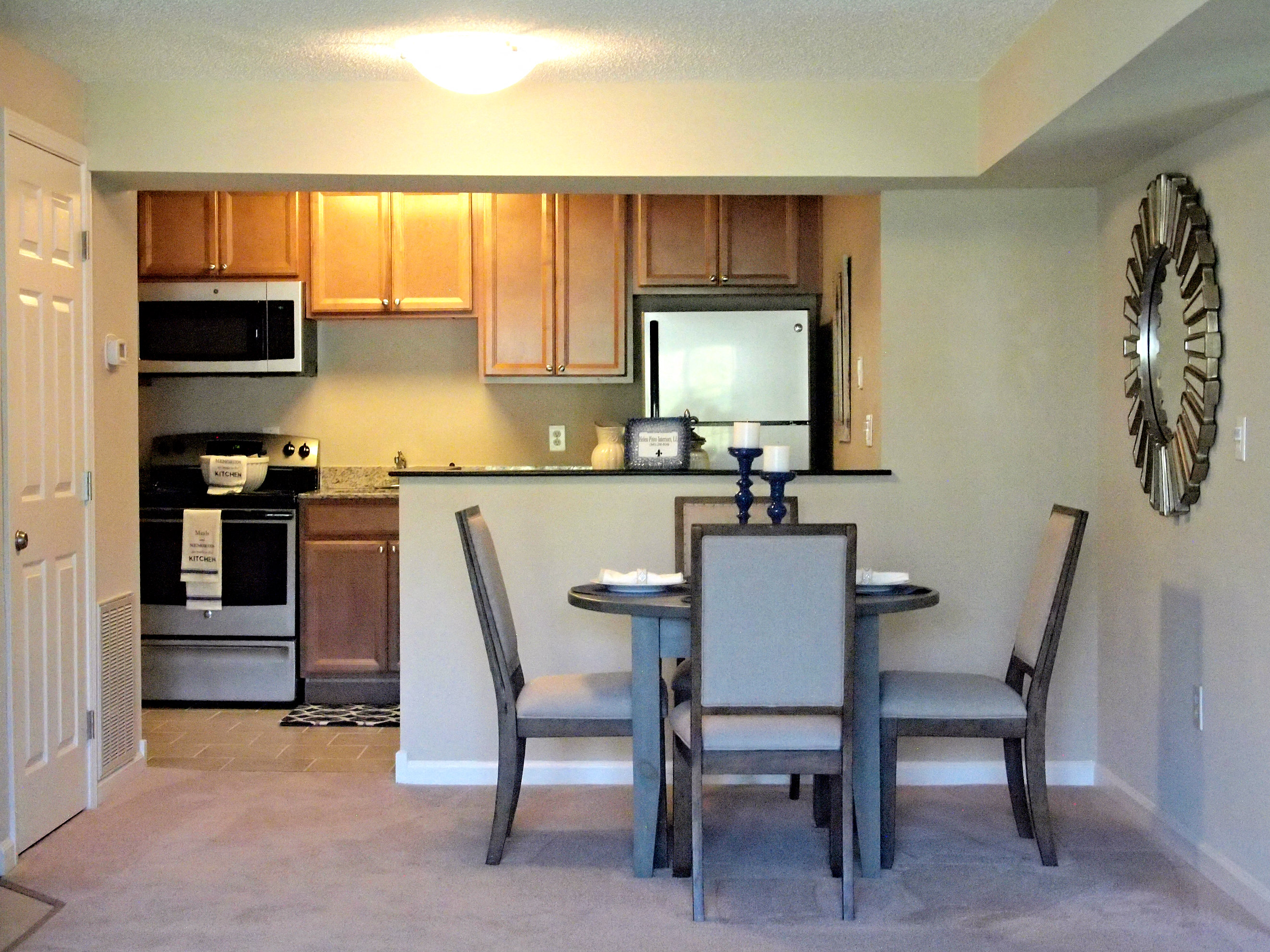 a kitchen and dining area with a table and chairs