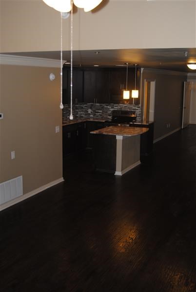 a kitchen with an island in the middle of a room