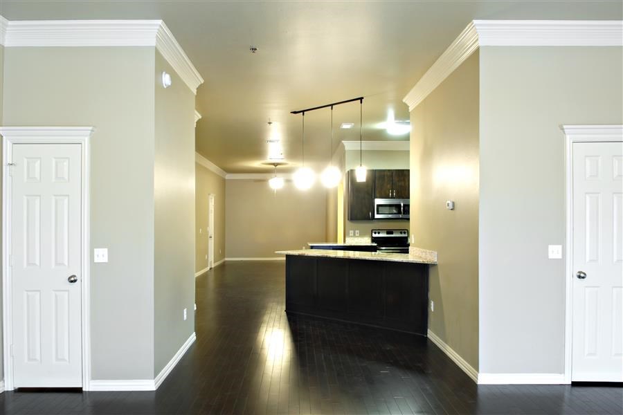 an empty kitchen with an island in the middle