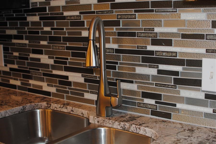 a kitchen with a sink and a faucet