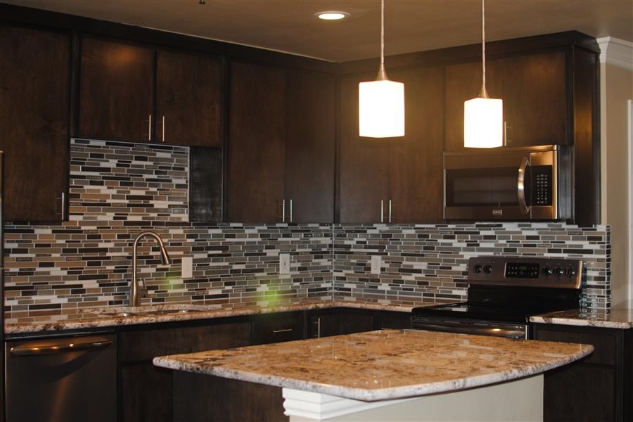 a kitchen with a granite counter top