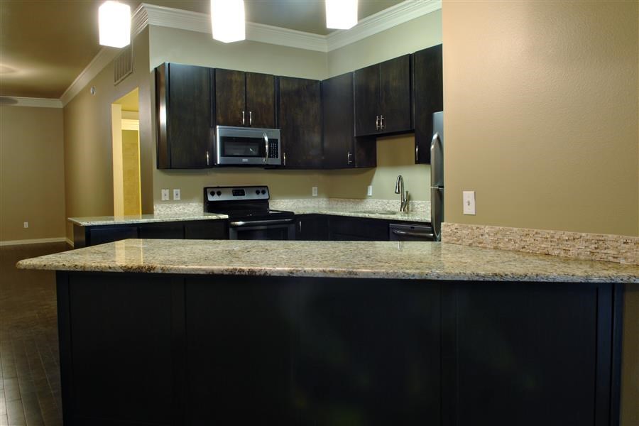 a kitchen with a granite counter top