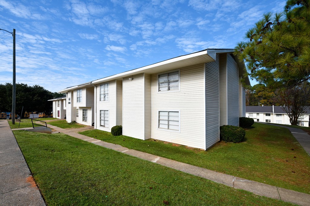 A row of houses with a clear blue sky above them.